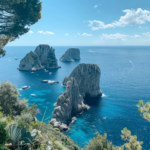 Scenic view of high rock formations and beautiful clear water at the destination